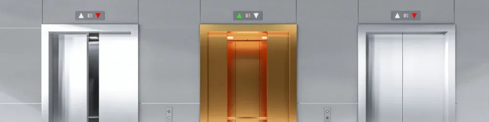 3 Elevator doors in a lobby